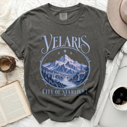 T-shirt with "Velaris City of Starlight" text and mountain landscape design.