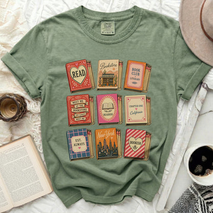 Green t-shirt with square graphics of books, bookstores, and reading-related text.