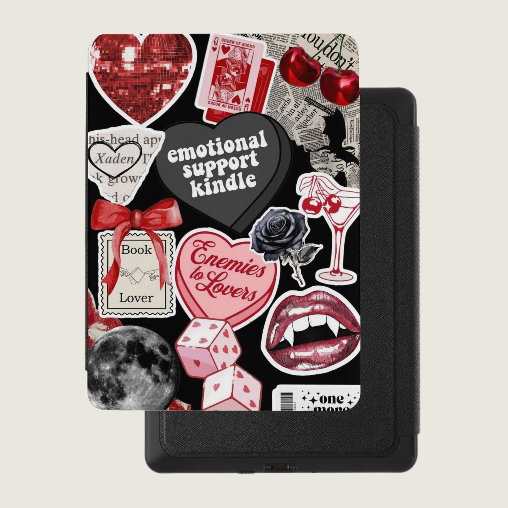 Kindle case with assorted stickers including hearts, dice, lips, and text.