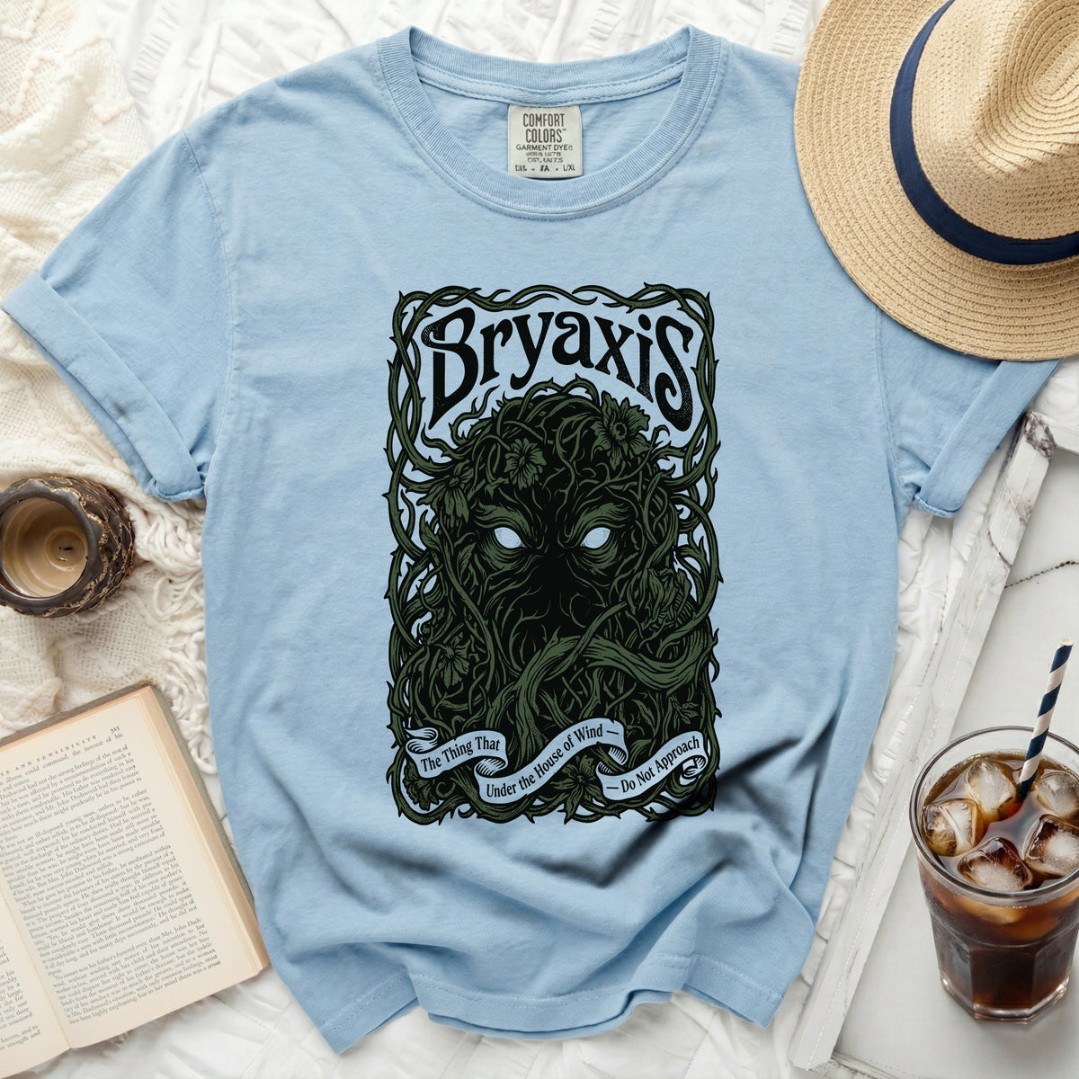 Light blue t-shirt with "Bryaxis" and a dark green nature-themed illustration.