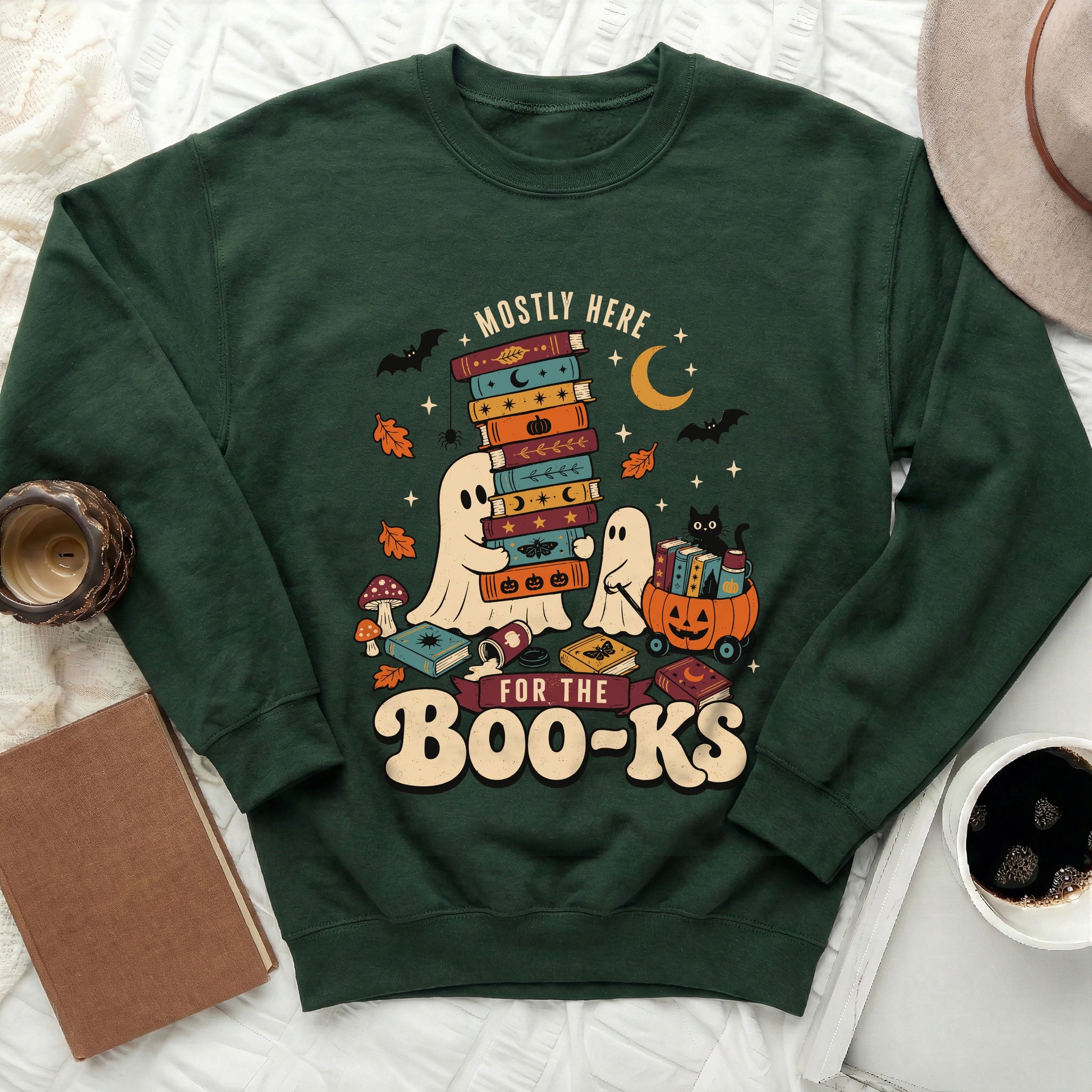 Green sweatshirt with ghosts, bats, moons, and "Mostly Here For The Boo-Ks" text.