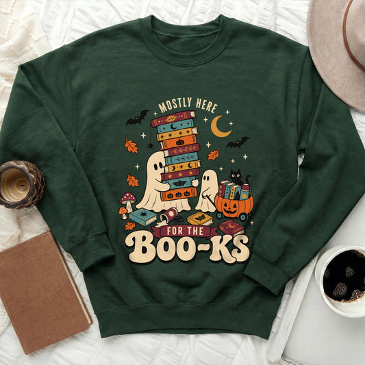 Green sweatshirt with ghosts, bats, moons, and "Mostly Here For The Boo-Ks" text.