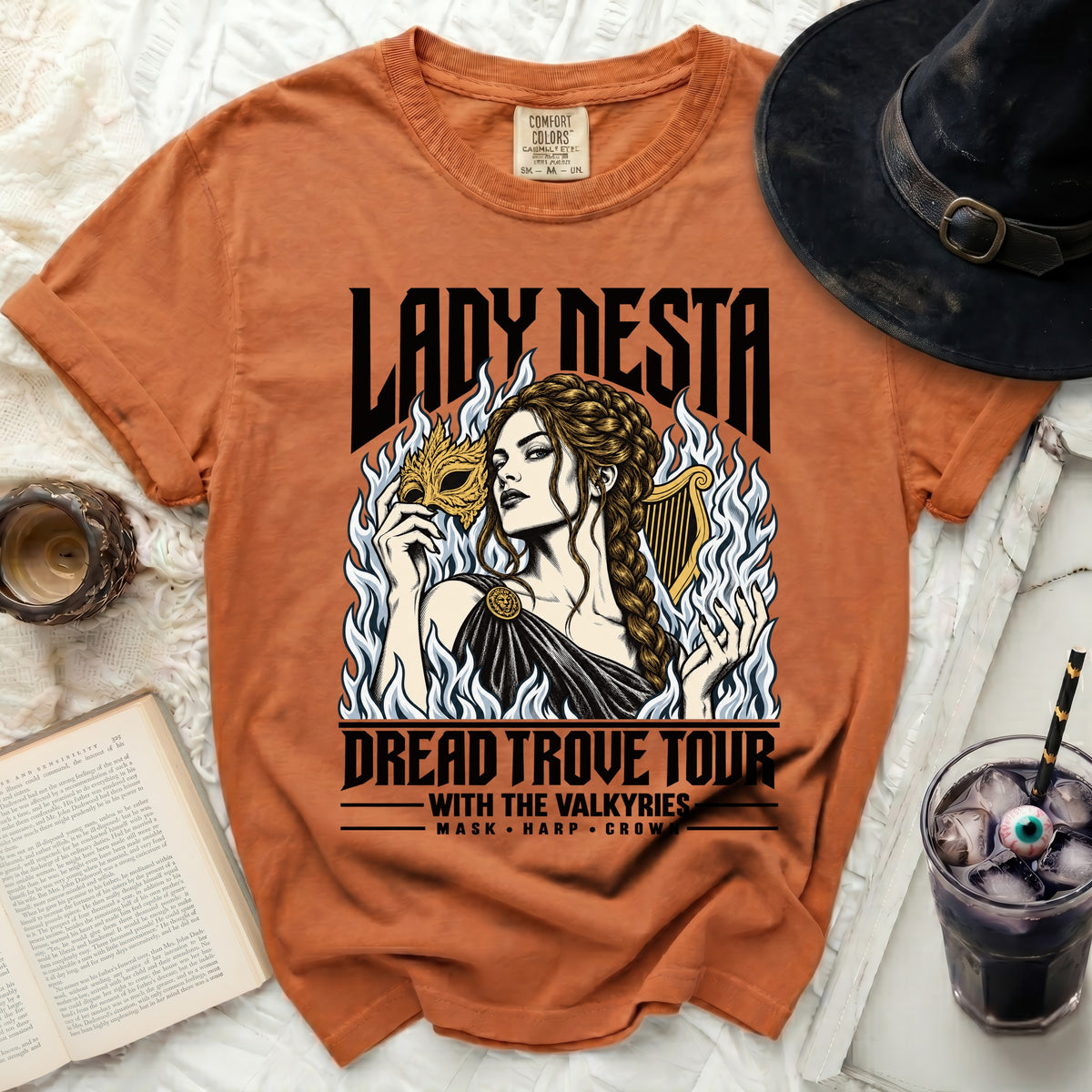 Orange t-shirt with "Lady Nesta Dread Trove Tour With The Valkyries" graphic.