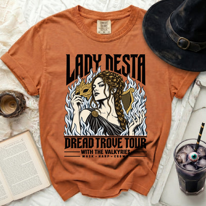Orange t-shirt with "Lady Nesta Dread Trove Tour With The Valkyries" graphic.