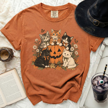 Orange t-shirt with a Comfort Colors tag featuring five kittens on a pumpkin.