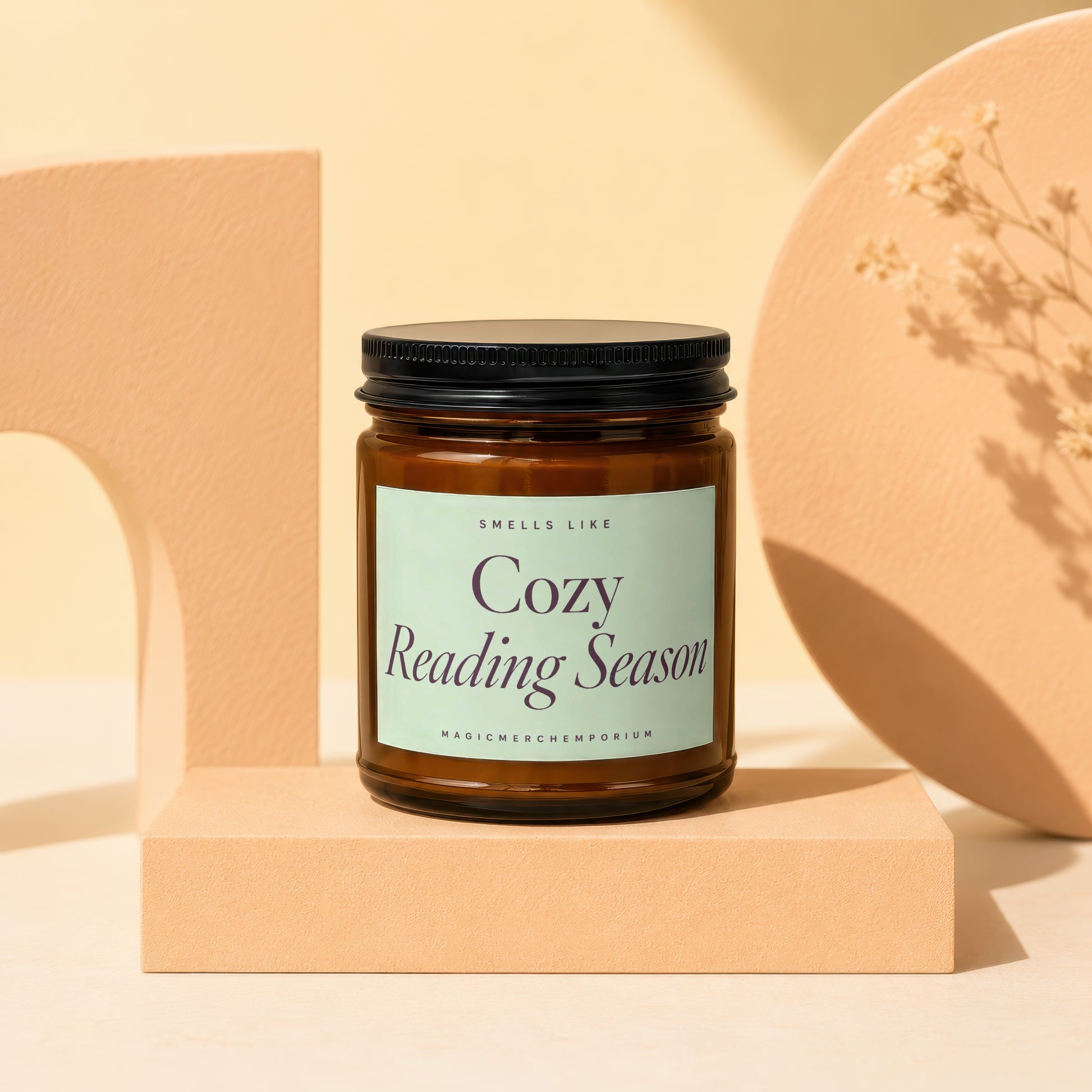 Amber jar candle labeled "Smells Like Cozy Reading Season" by MagicMerchEmporium.