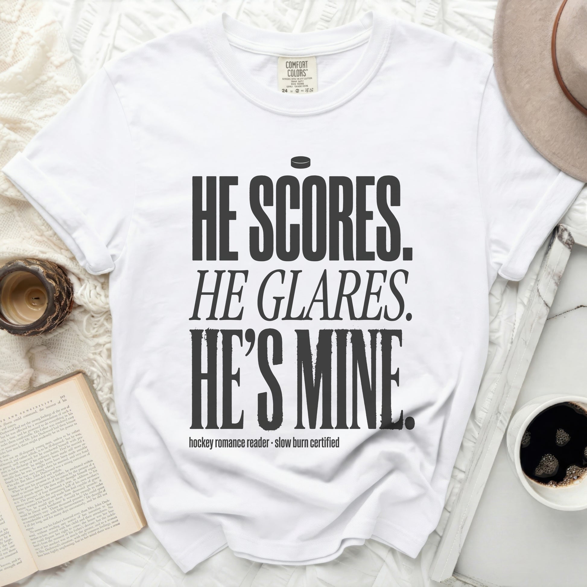White t-shirt with "He scores. He glares. He's mine." text.