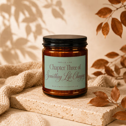 Amber candle with a label reading "Smells Like Chapter Three of Something Life-Changing".