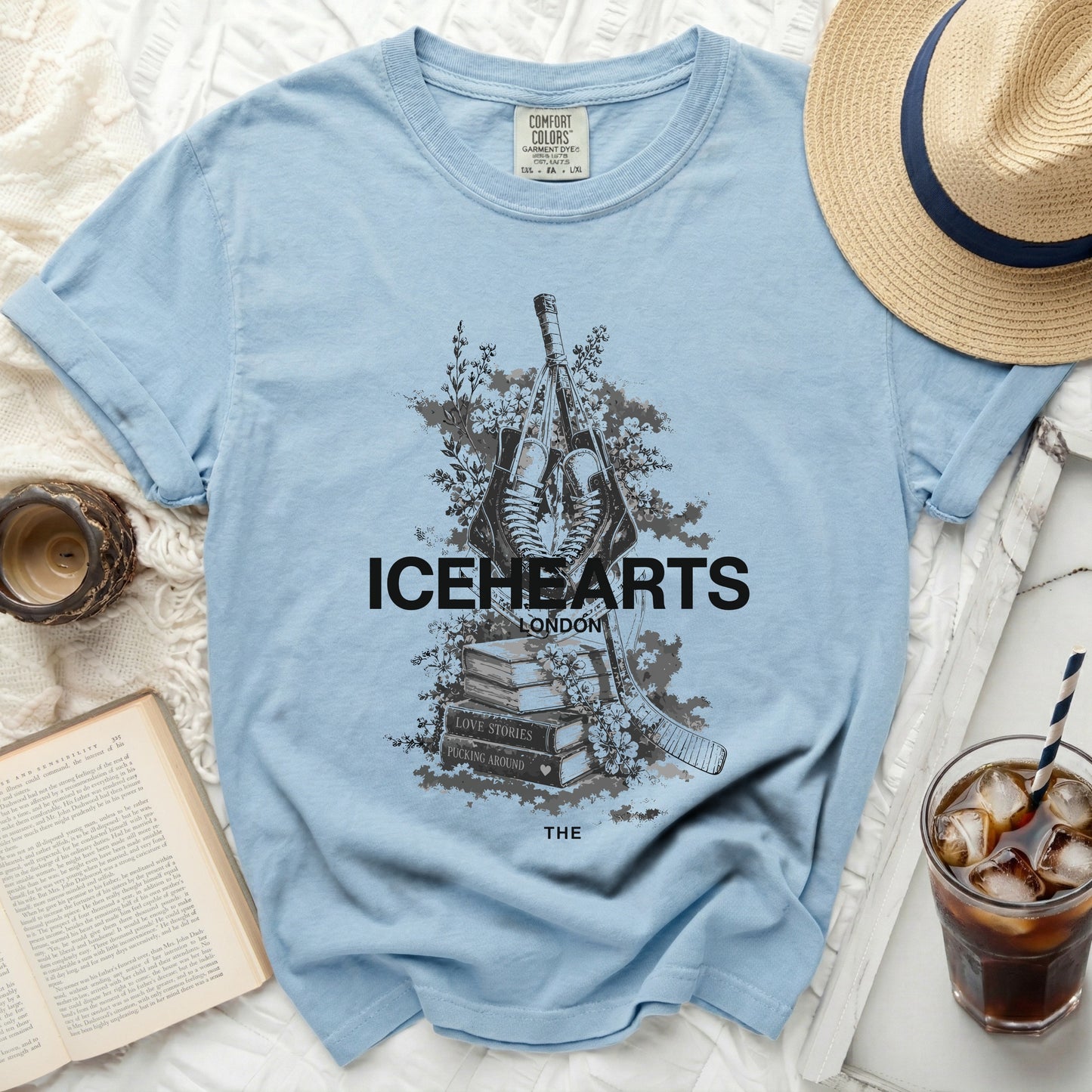 Light blue t-shirt with "ICEHEARTS LONDON" and book graphics.