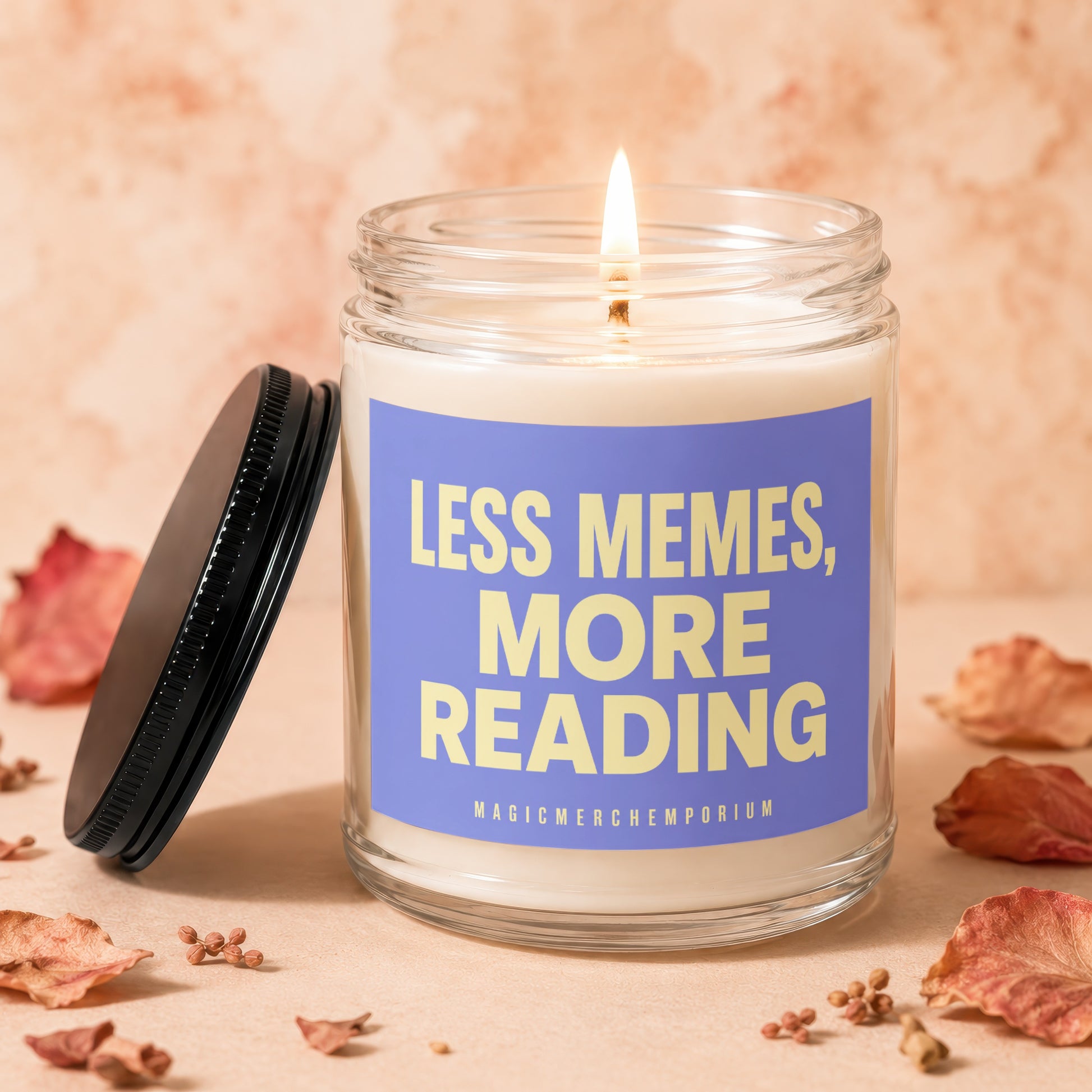 Glass jar candle with purple label reading "LESS MEMES, MORE READING".