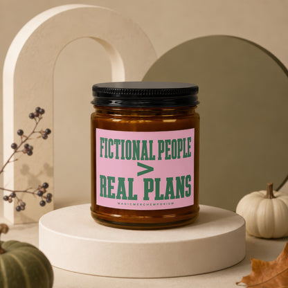 Amber jar candle with pink label reading "FICTIONAL PEOPLE > REAL PLANS"