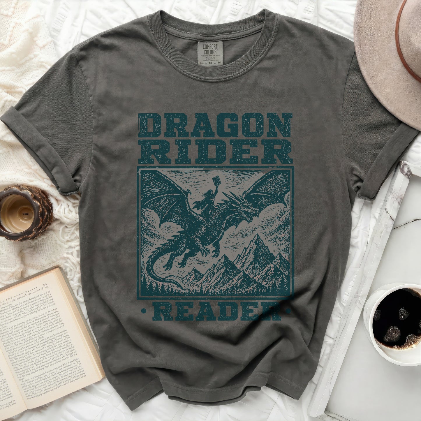 Dark grey t-shirt with "Dragon Rider Reader" text and illustration.