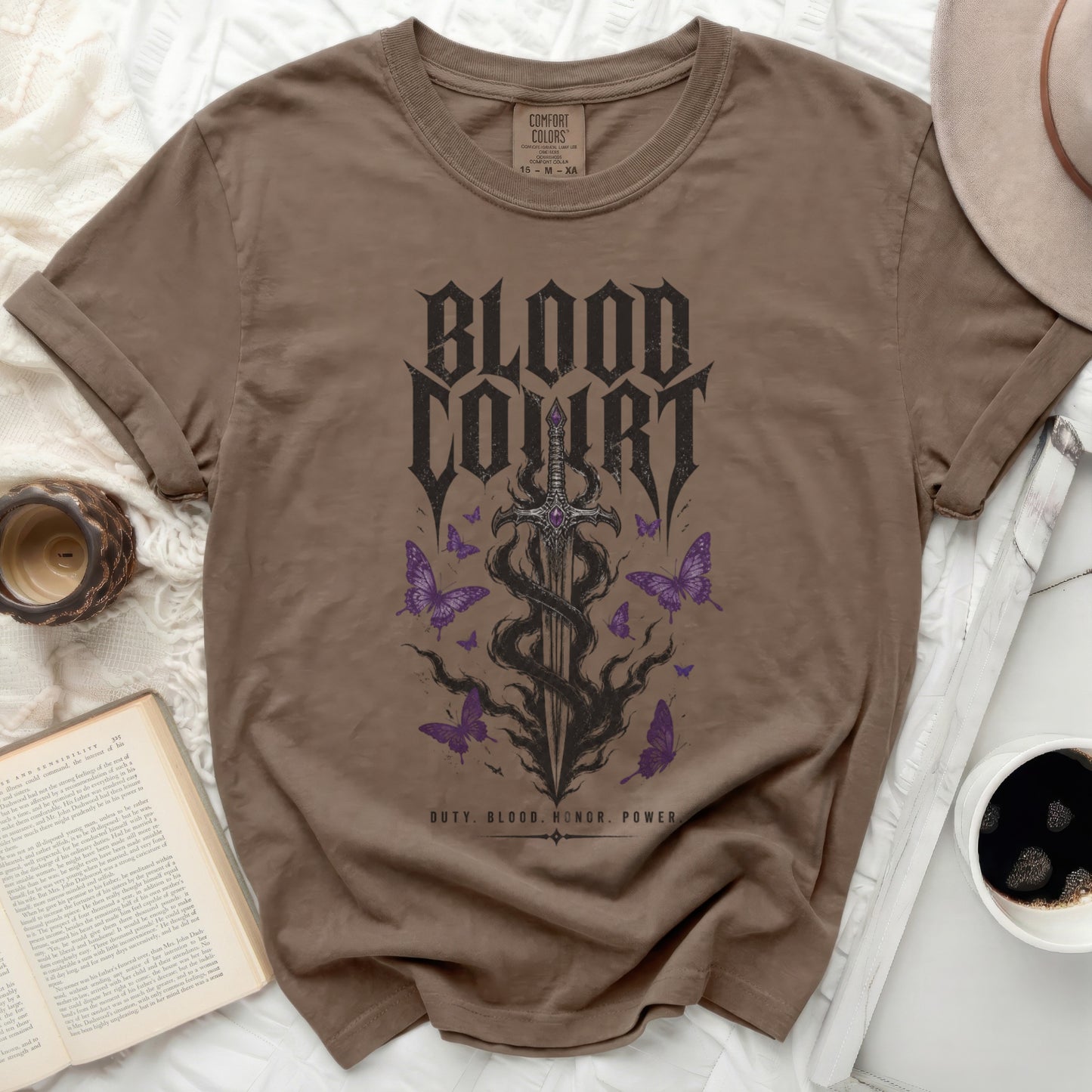 Brown t-shirt with "Blood Court" text and gothic sword with butterflies.