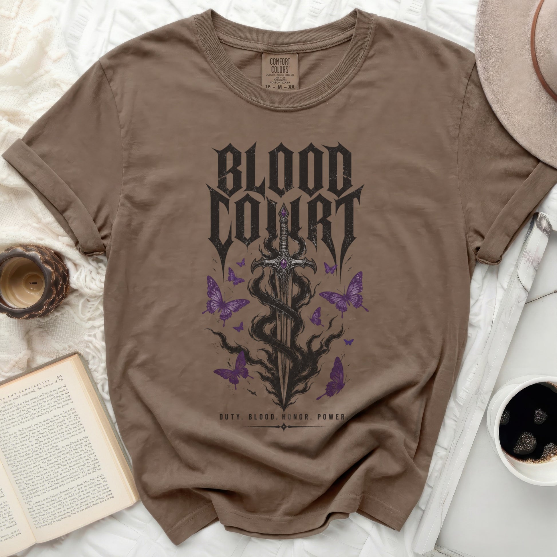Brown t-shirt with "Blood Court" text and gothic sword with butterflies.