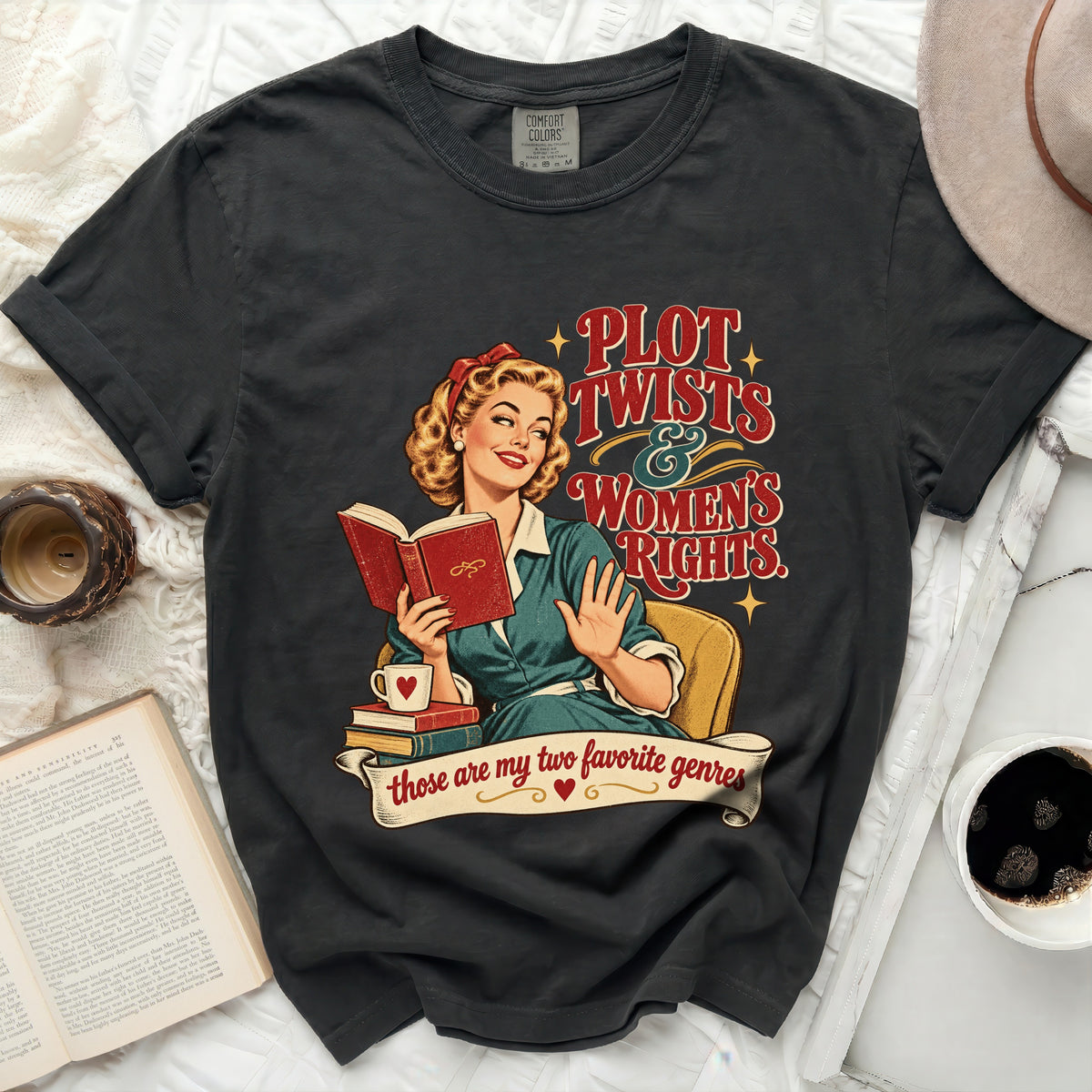 Graphic t-shirt with retro woman reading and text "PLOT TWISTS & WOMEN'S RIGHTS".
