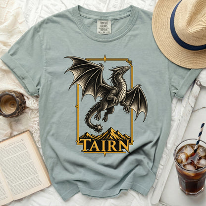 T-shirt with a black dragon graphic over mountains and the text "TAIRN".