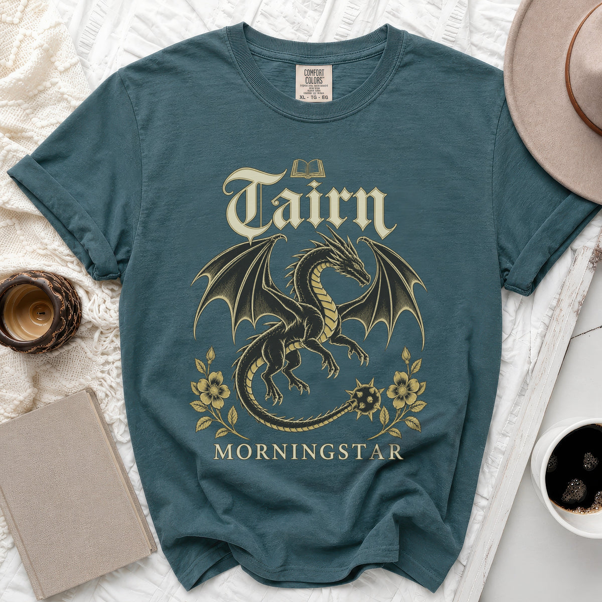 Teal t-shirt with a black dragon graphic, gold text "Tairn" and "Morningstar".