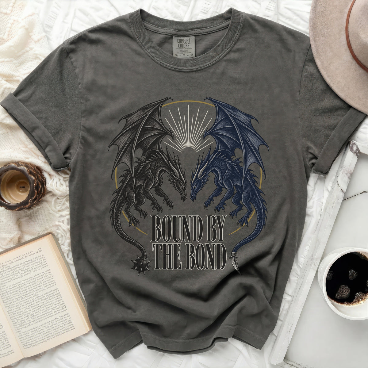 Dark grey t-shirt with black and blue dragons and text "Bound by the Bond".