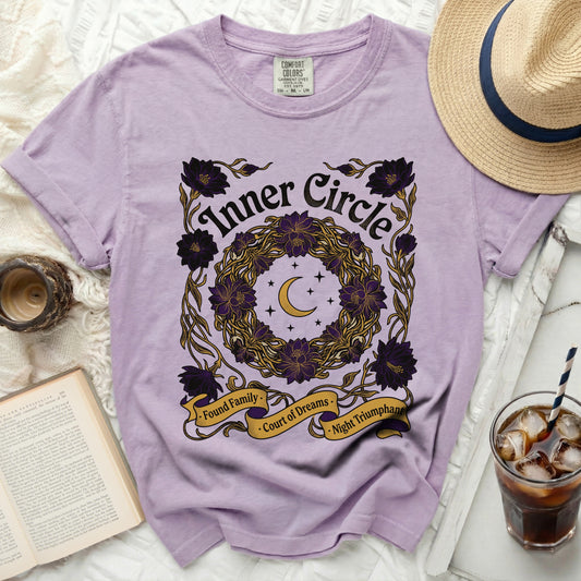 Lavender t-shirt with "Inner Circle" text and floral wreath graphic.