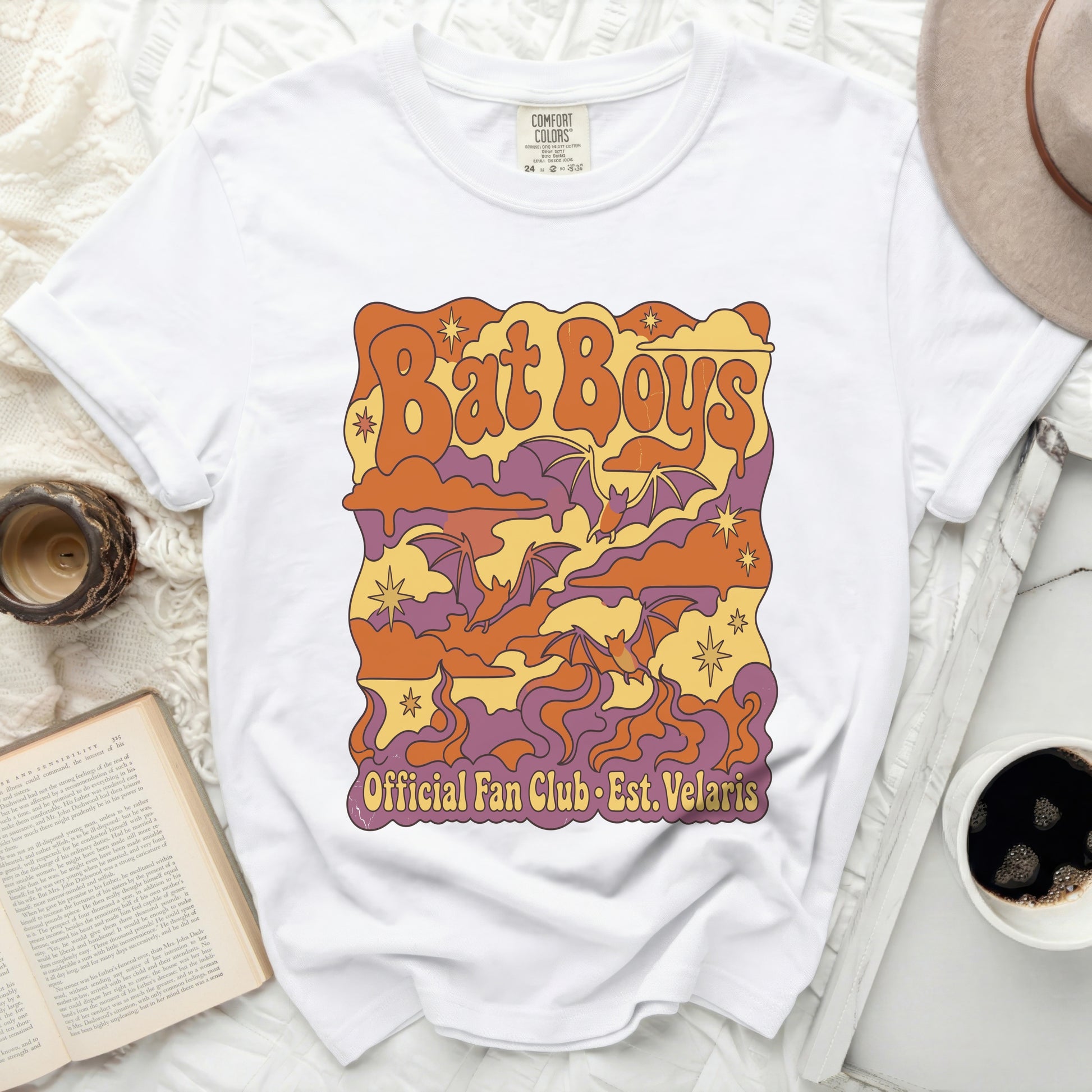 White t-shirt with "Bat Boys Official Fan Club Est. Velaris" graphic.