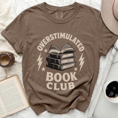 Brown t-shirt with "Overstimulated Book Club" graphic and stacked books.