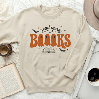 Cream sweatshirt with "read more BRAAKS" Halloween ghost graphic.