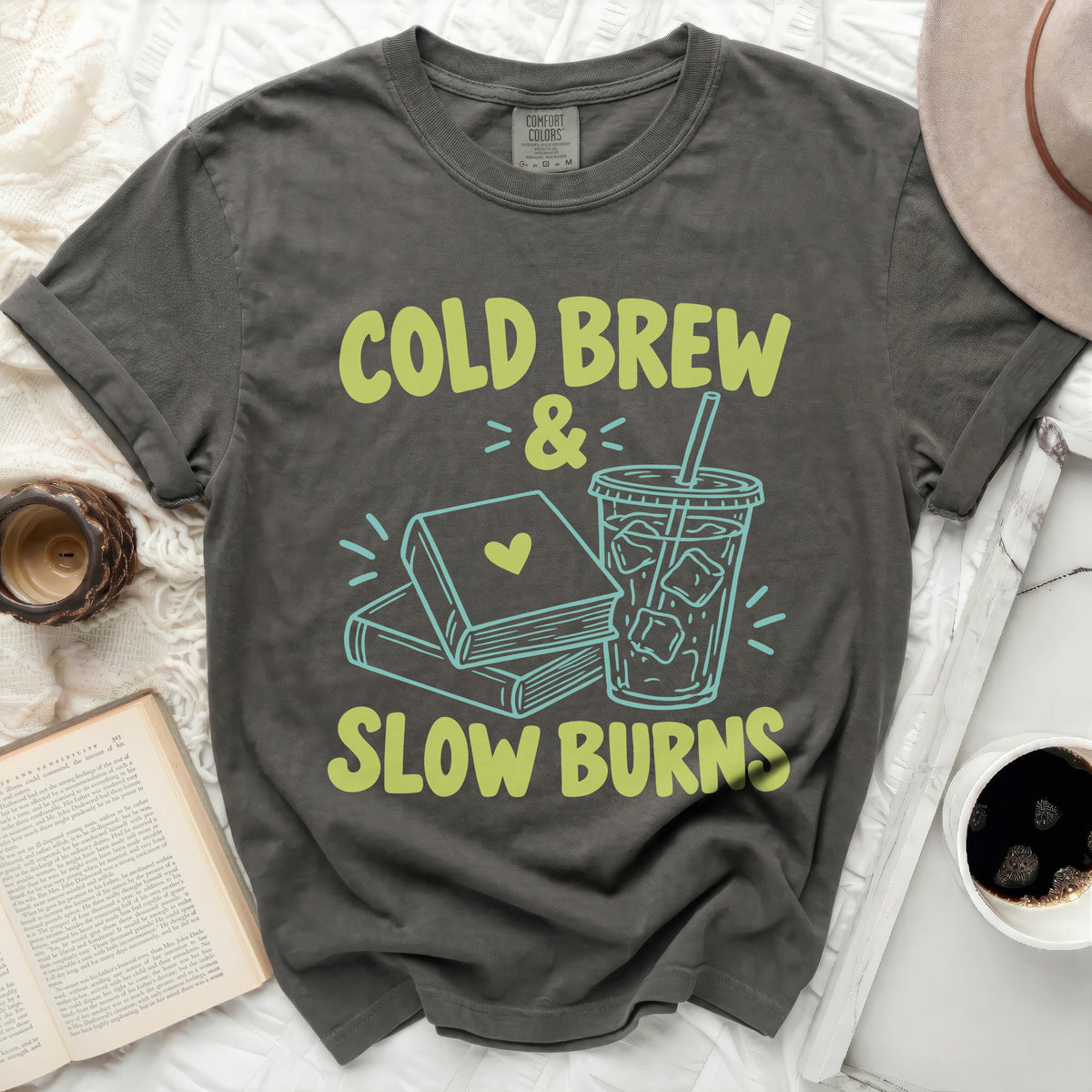 Gray t-shirt with "Cold Brew & Slow Burns" text, books, and iced coffee graphic.