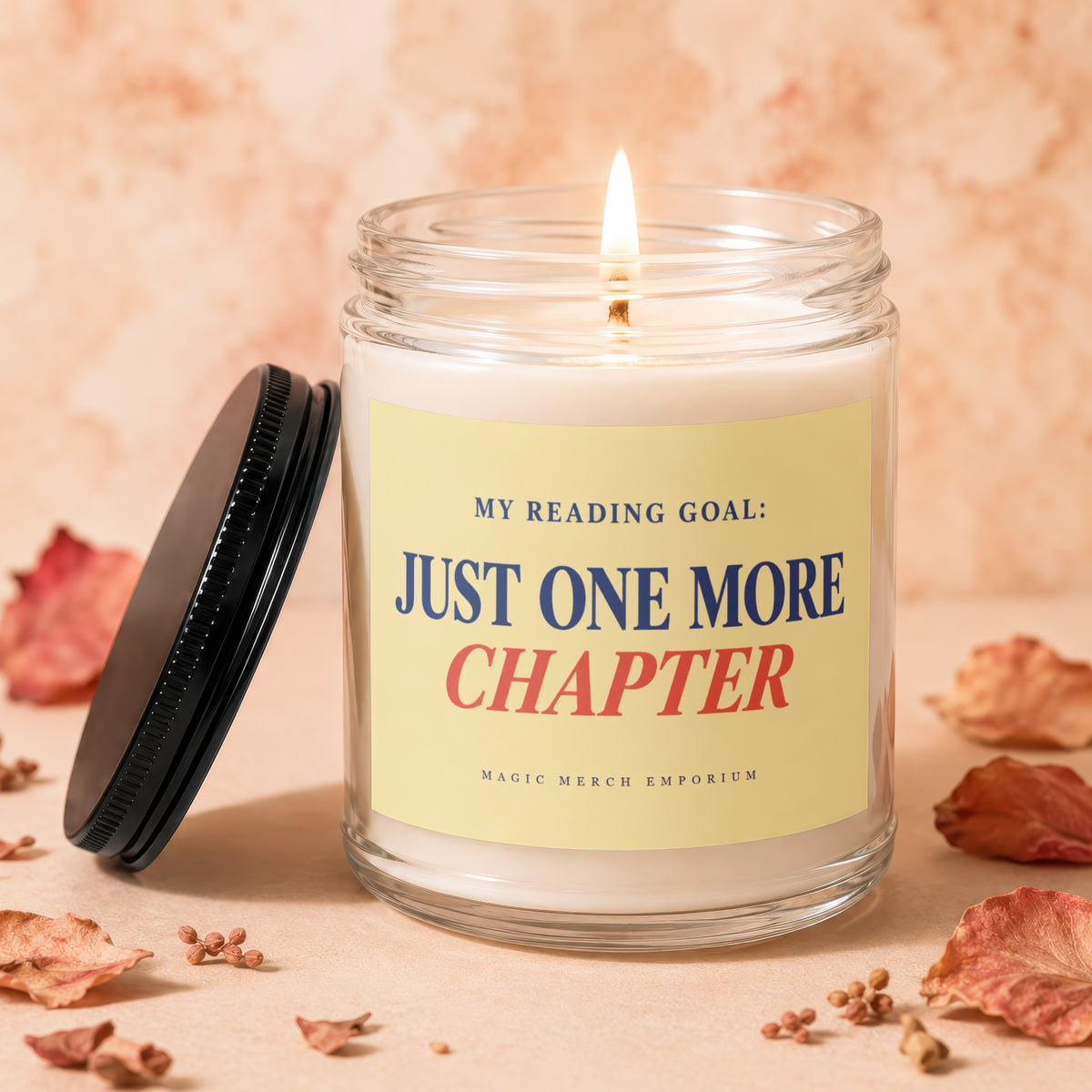 Lit candle with label reading "MY READING GOAL: JUST ONE MORE CHAPTER".