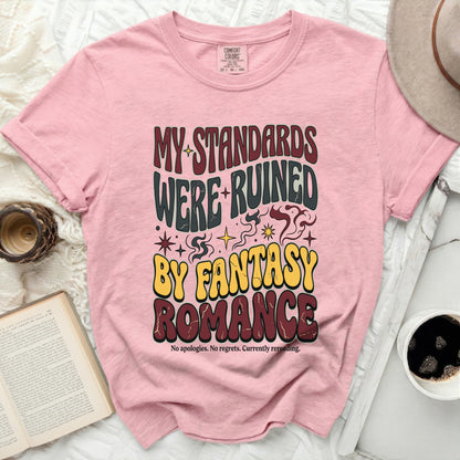 Pink t-shirt with text "MY STANDARDS WERE RUINED BY FANTASY ROMANCE"