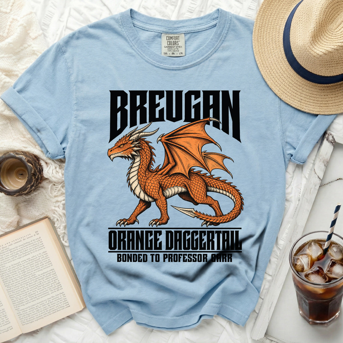 Light blue t-shirt with "BREUGAN", an orange dragon, and "ORANGE DAGGERTAIL" text.