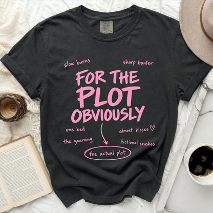 Dark t-shirt with pink text "For the plot obviously" and related phrases.