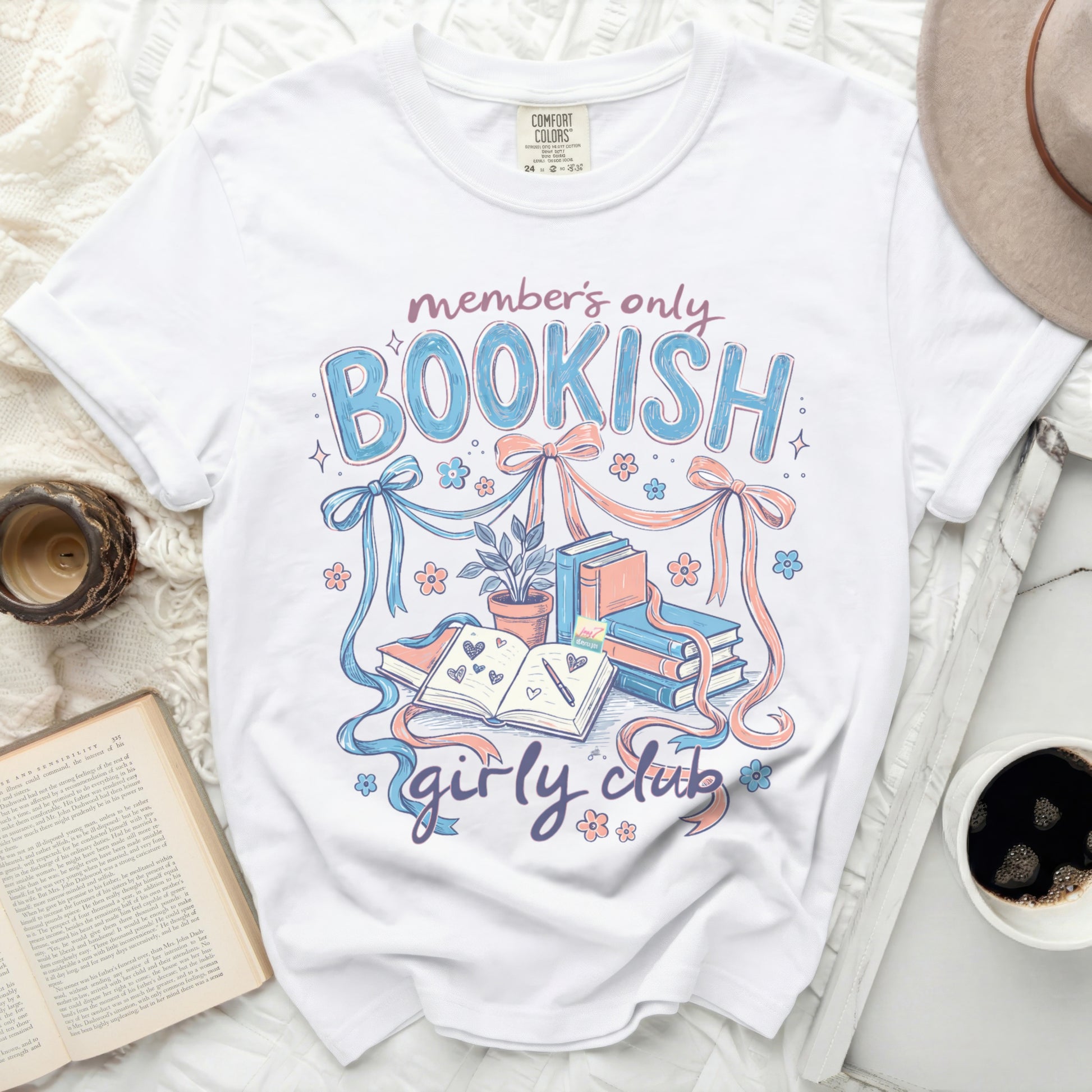 White t-shirt with "Bookish Girly Club" text and book illustrations.