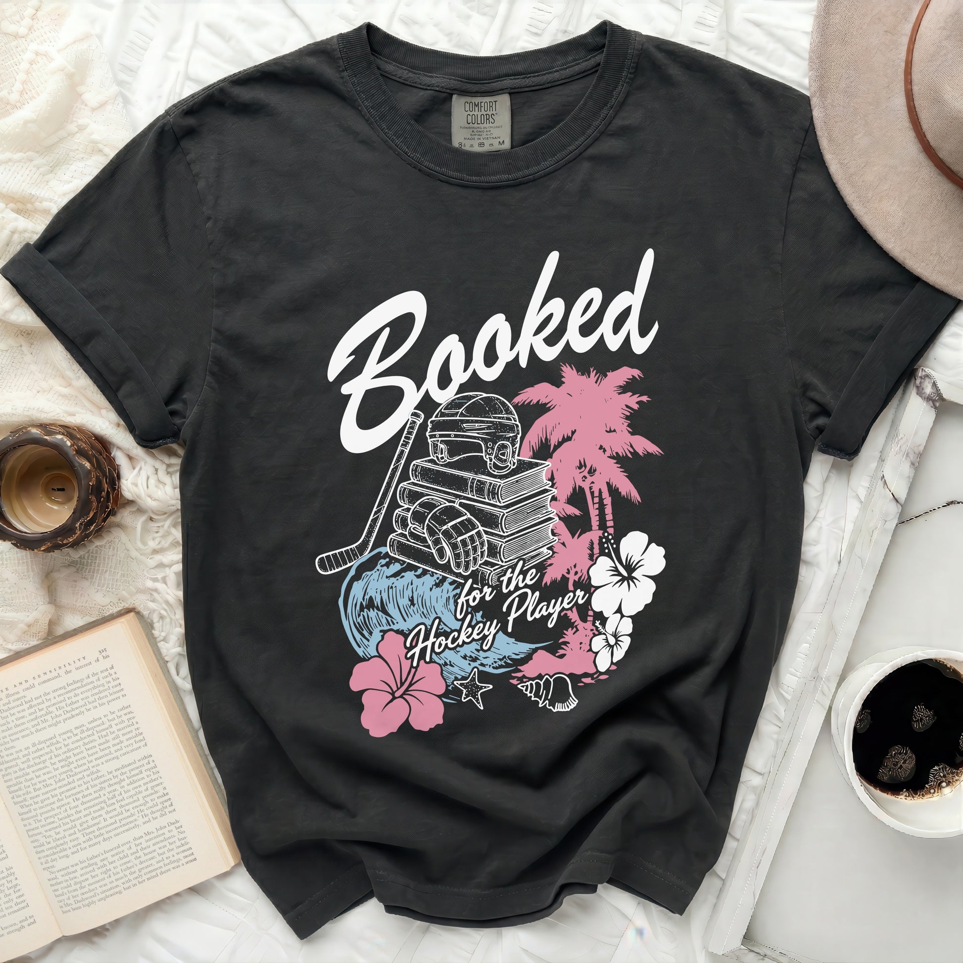 Black t-shirt with "Booked for the Hockey Player" text and graphics.