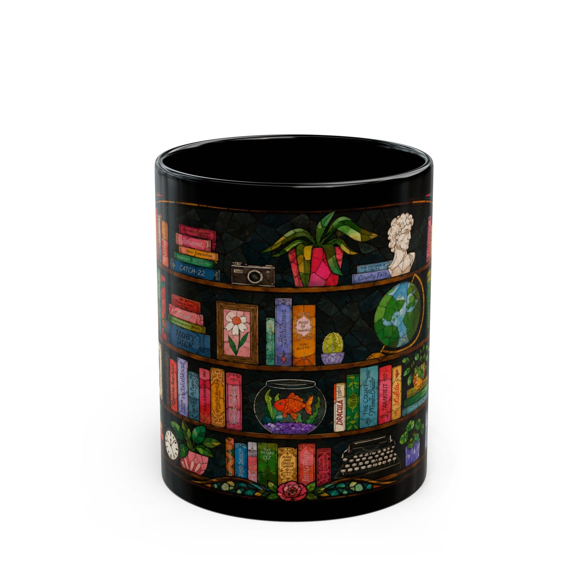 Black mug with stained glass art of bookshelves, books, a goldfish, and a typewriter.