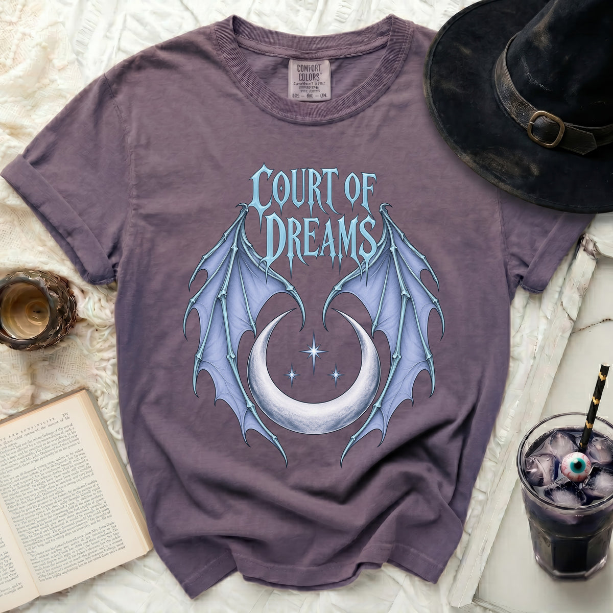 Purple t-shirt with "Court of Dreams" text, wings, and crescent moon graphic.