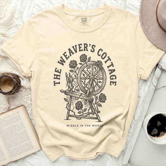 Cream t-shirt with "The Weaver's Cottage Middle in the Woods" circular graphic.