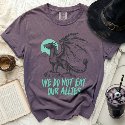 Purple t-shirt with a black dragon graphic and text "We Do Not Eat Our Allies".