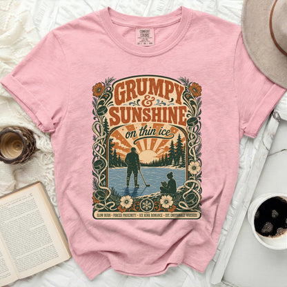 Pink t-shirt with "Grumpy Sunshine on Thin Ice" and hockey graphic.