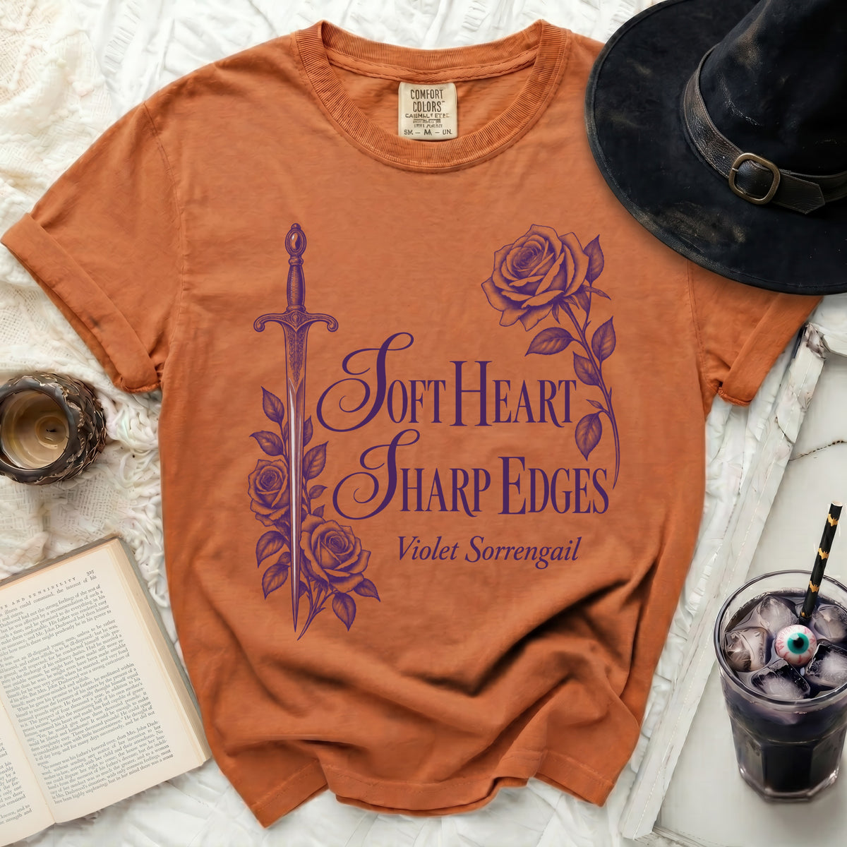 Orange t-shirt with purple sword, roses, and text "Soft Heart Sharp Edges Violet Sorrengail".