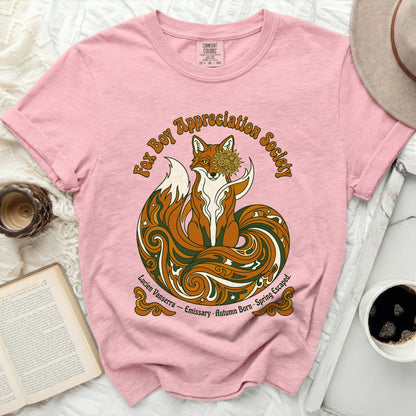 Pink t-shirt with a "Fox Boy Appreciation Society" graphic featuring a stylized fox and ornate design.