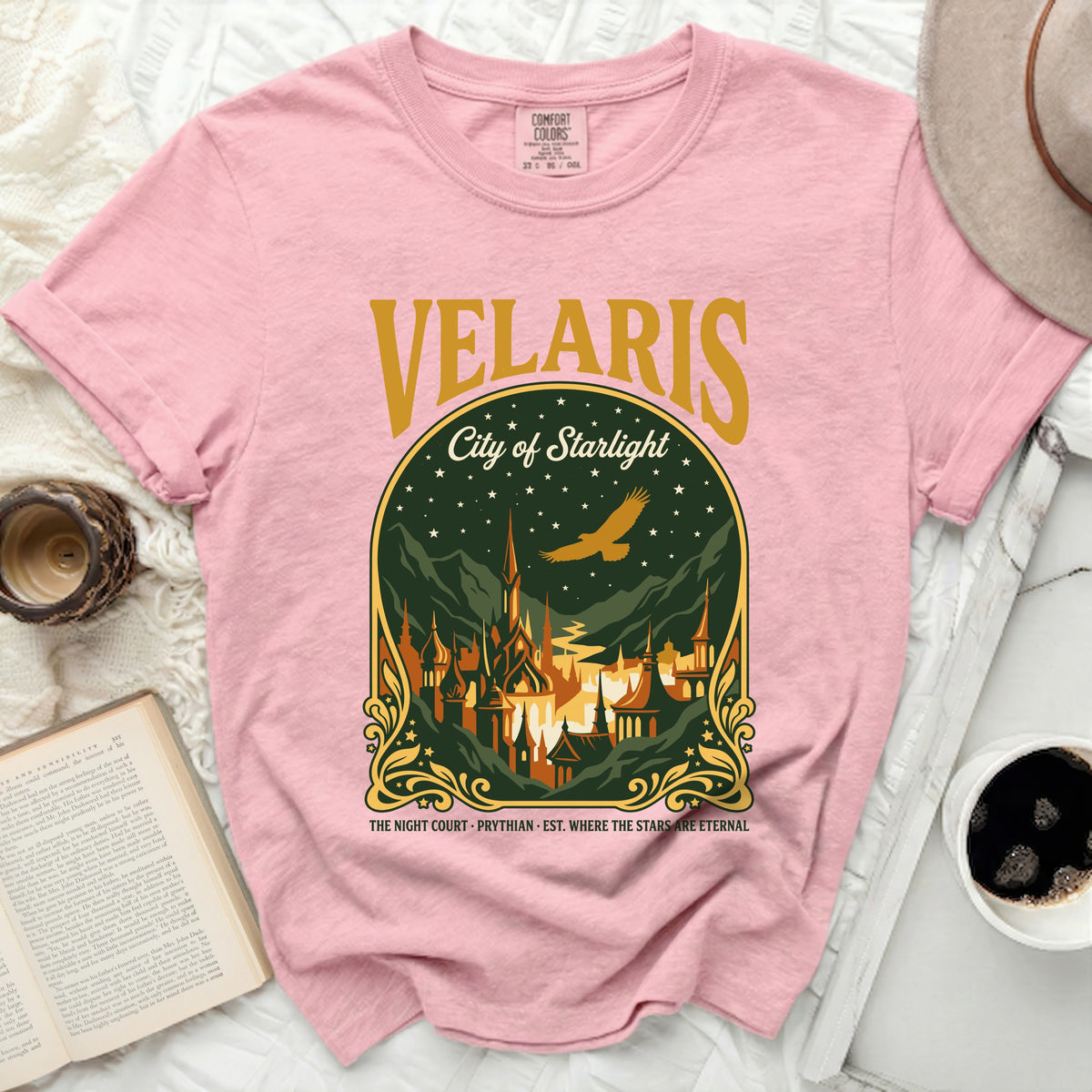 Pink t-shirt with gold and green Velaris City of Starlight graphic.