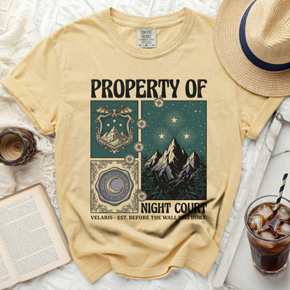 Yellow t-shirt with "PROPERTY OF NIGHT COURT" and illustrated design elements.
