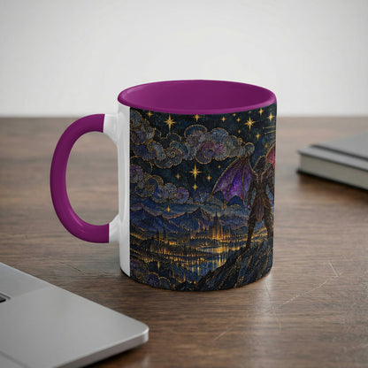 White ceramic mug with a purple rim and handle, featuring a fantasy landscape graphic with a winged creature overlooking a lit city beneath a starry sky.