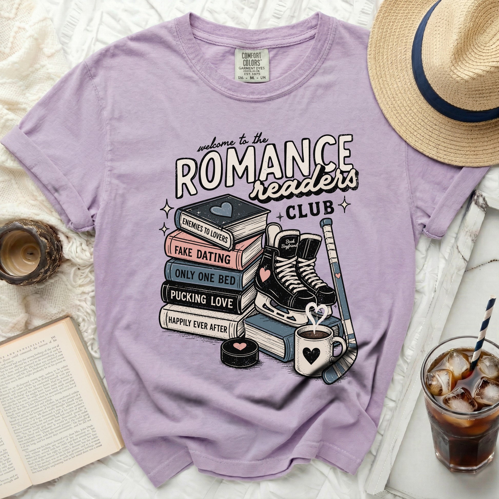 Purple t-shirt with "Romance Readers Club" books and hockey gear graphic.