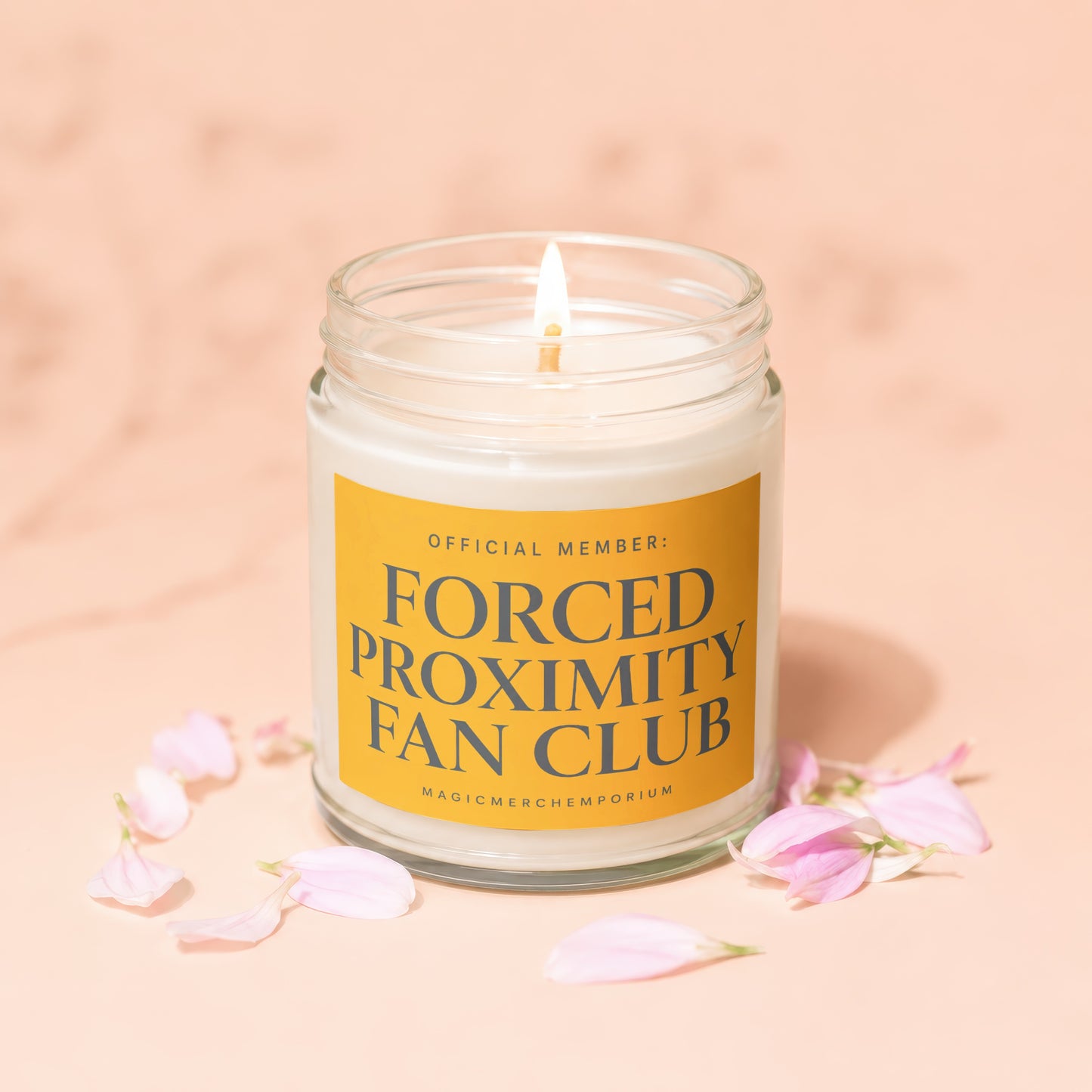 Candle labeled "Official Member: Forced Proximity Fan Club" with lit wick and pink petals.