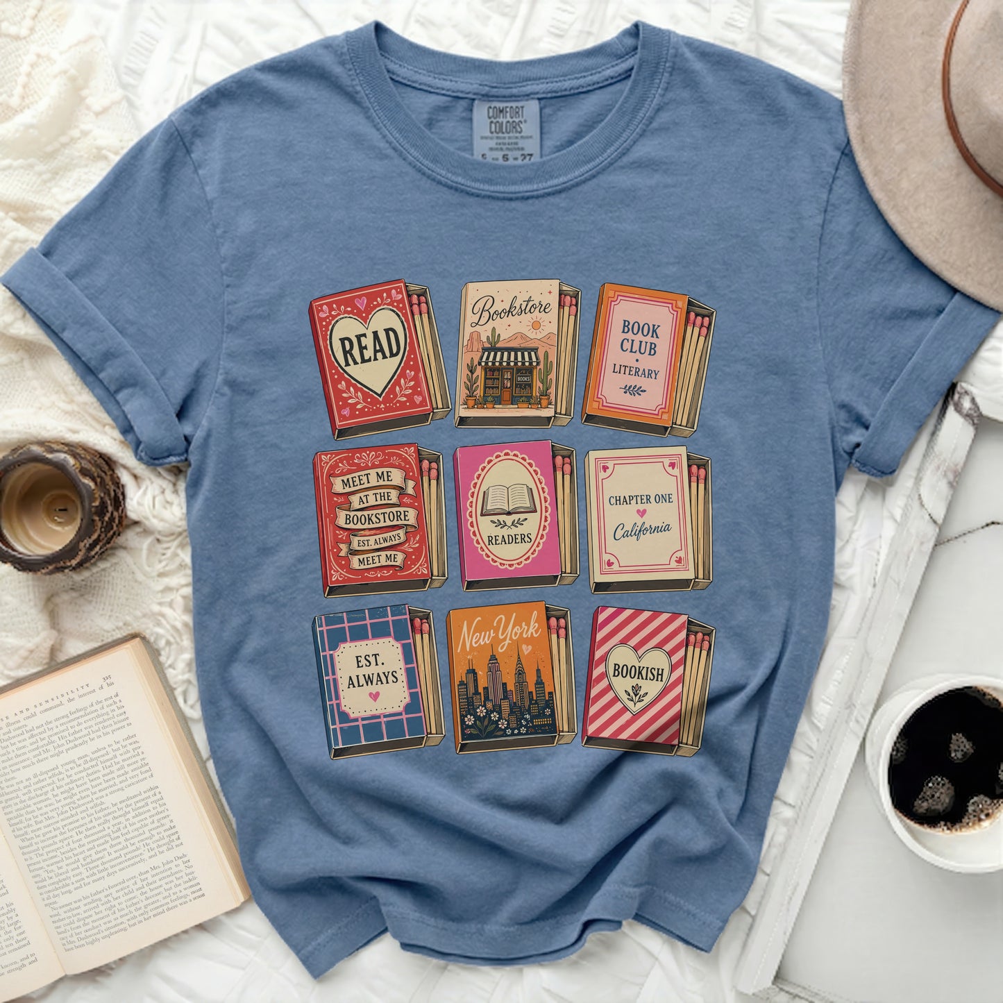 T-shirt with book-themed matchboxes and literary quotes.