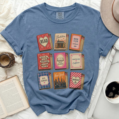 T-shirt with book-themed matchboxes and literary quotes.
