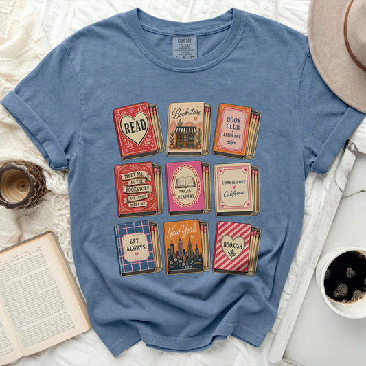 T-shirt with book-themed matchboxes and literary quotes.