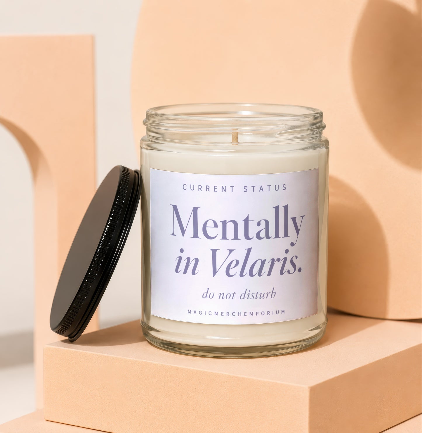 Candle labeled "Mentally in Velaris. do not disturb." with lid off.