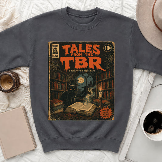 Dark grey crewneck sweatshirt with "Tales From The TBR: A bookworm's nightmare" comic book graphic.
